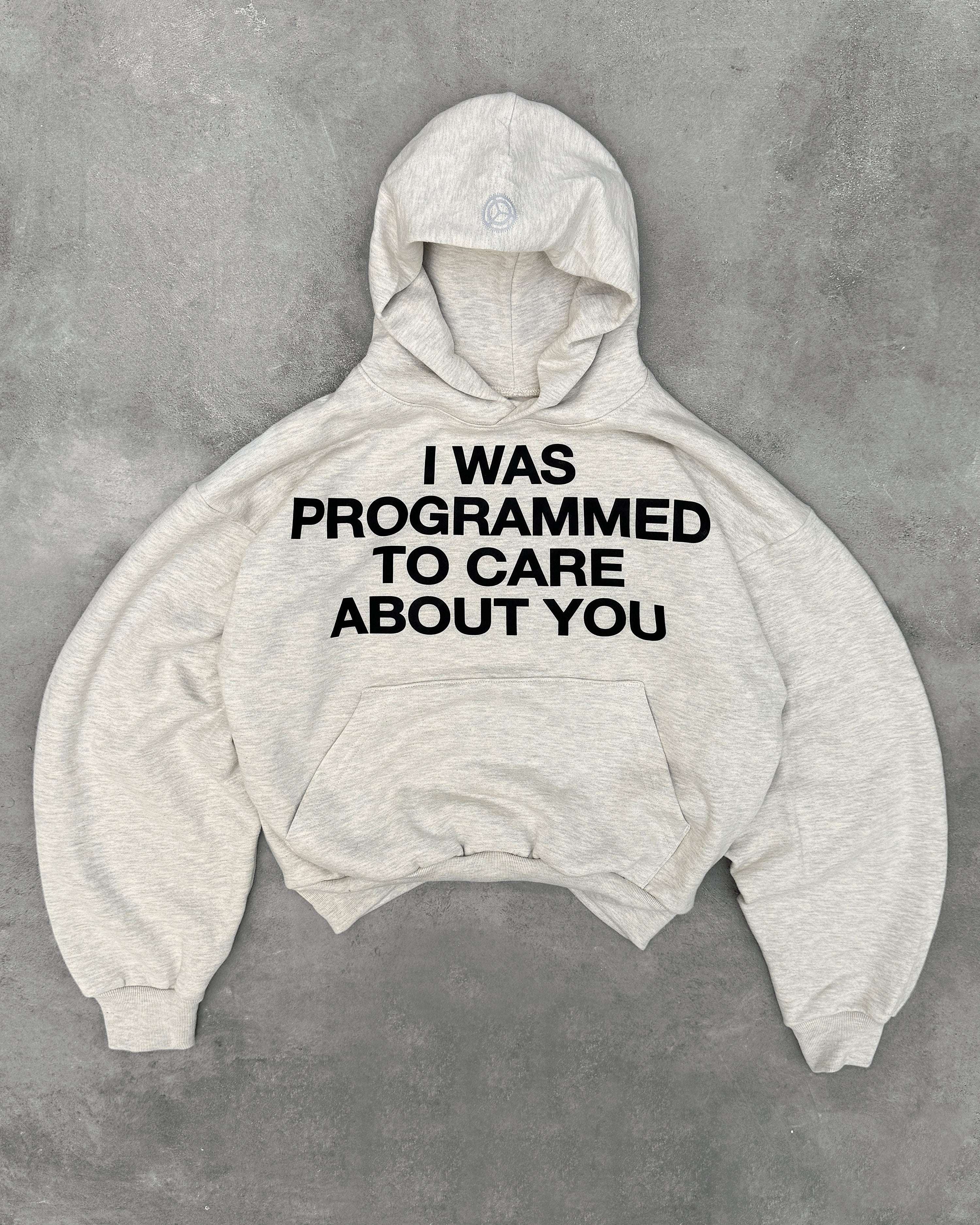 "PROGRAMMED TO CARE" HOODIE