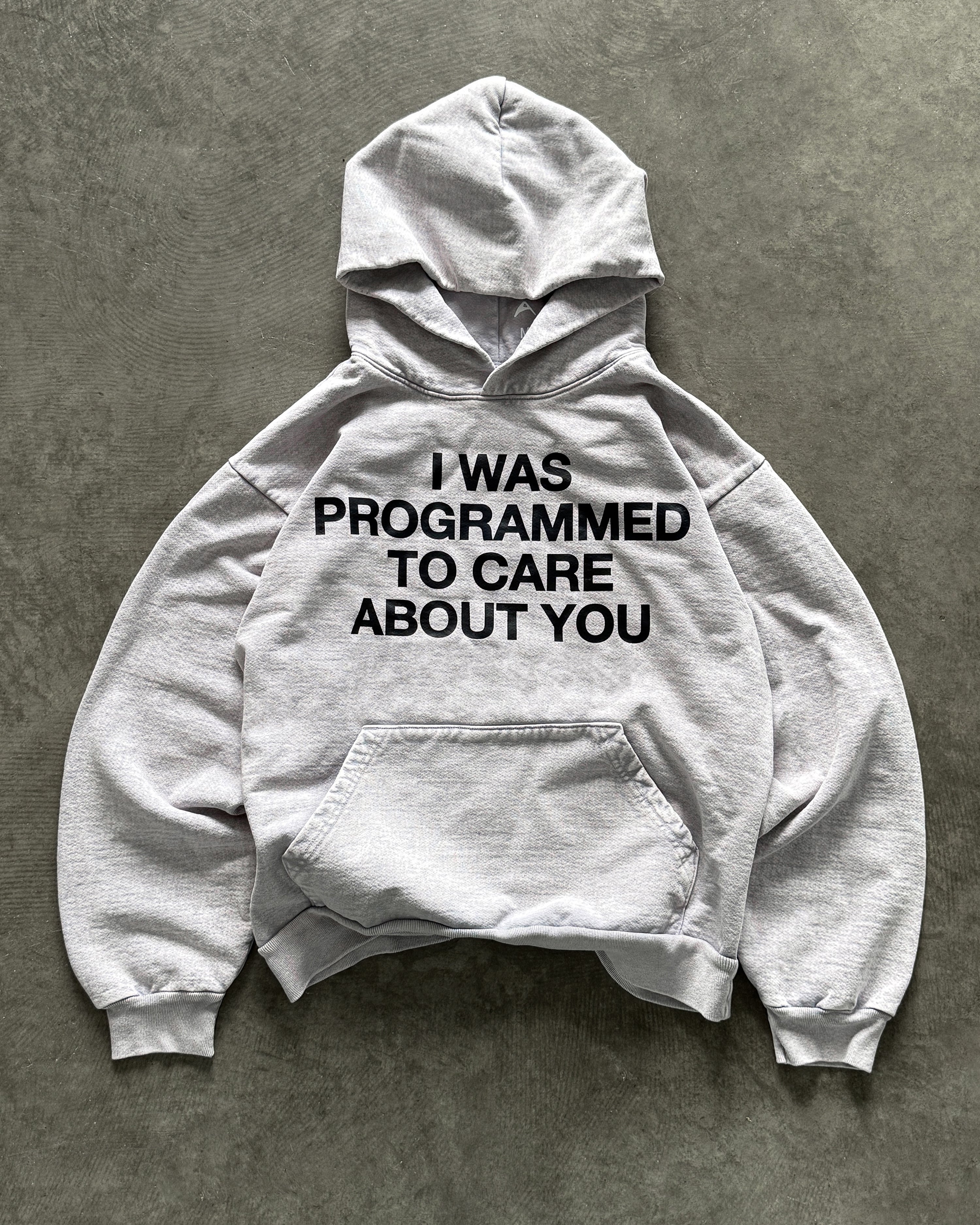 "PROGRAMMED TO CARE" HOODIE