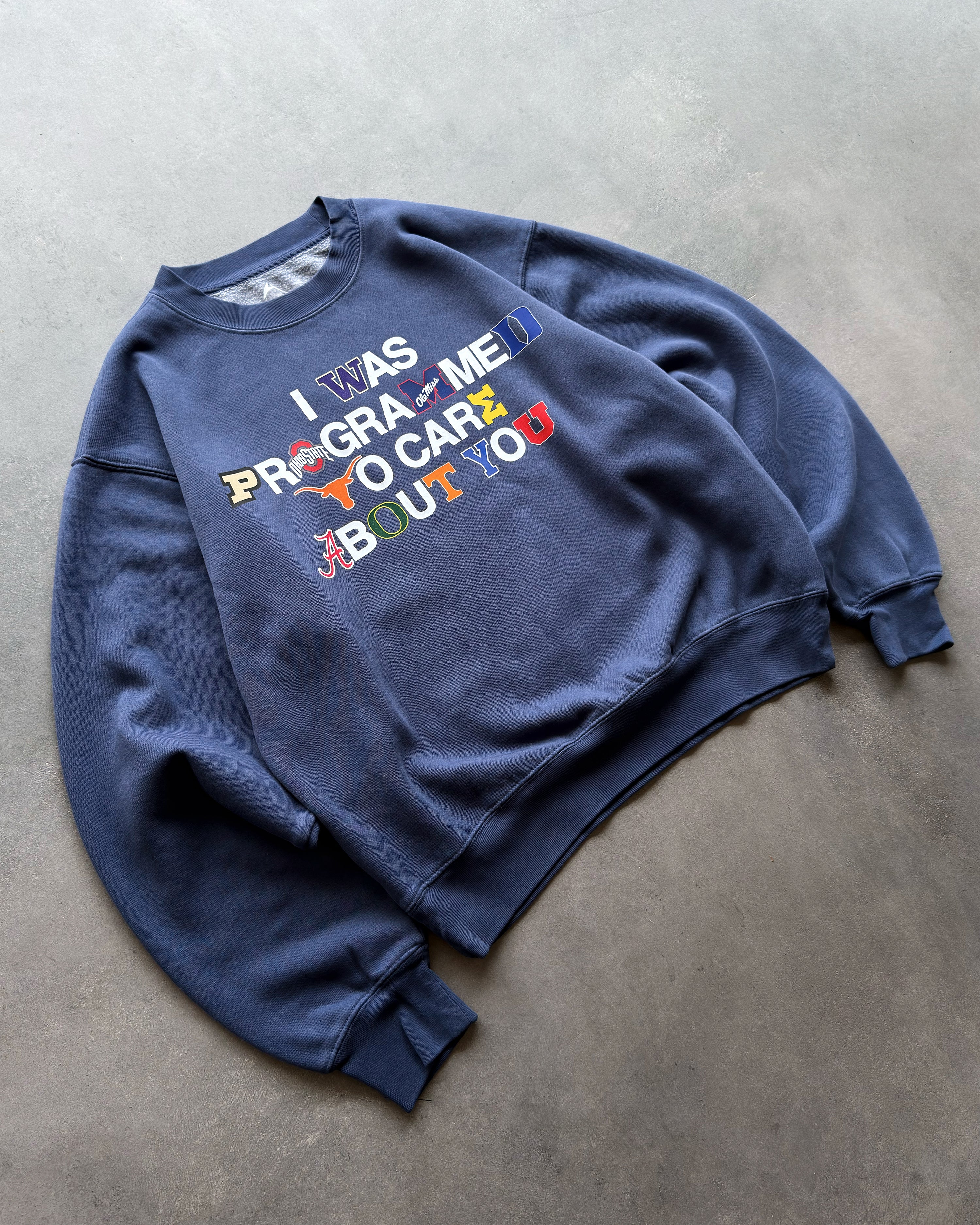 "PROGRAMMED TO CARE" COLLEGE CREWNECK SWEATSHIRT