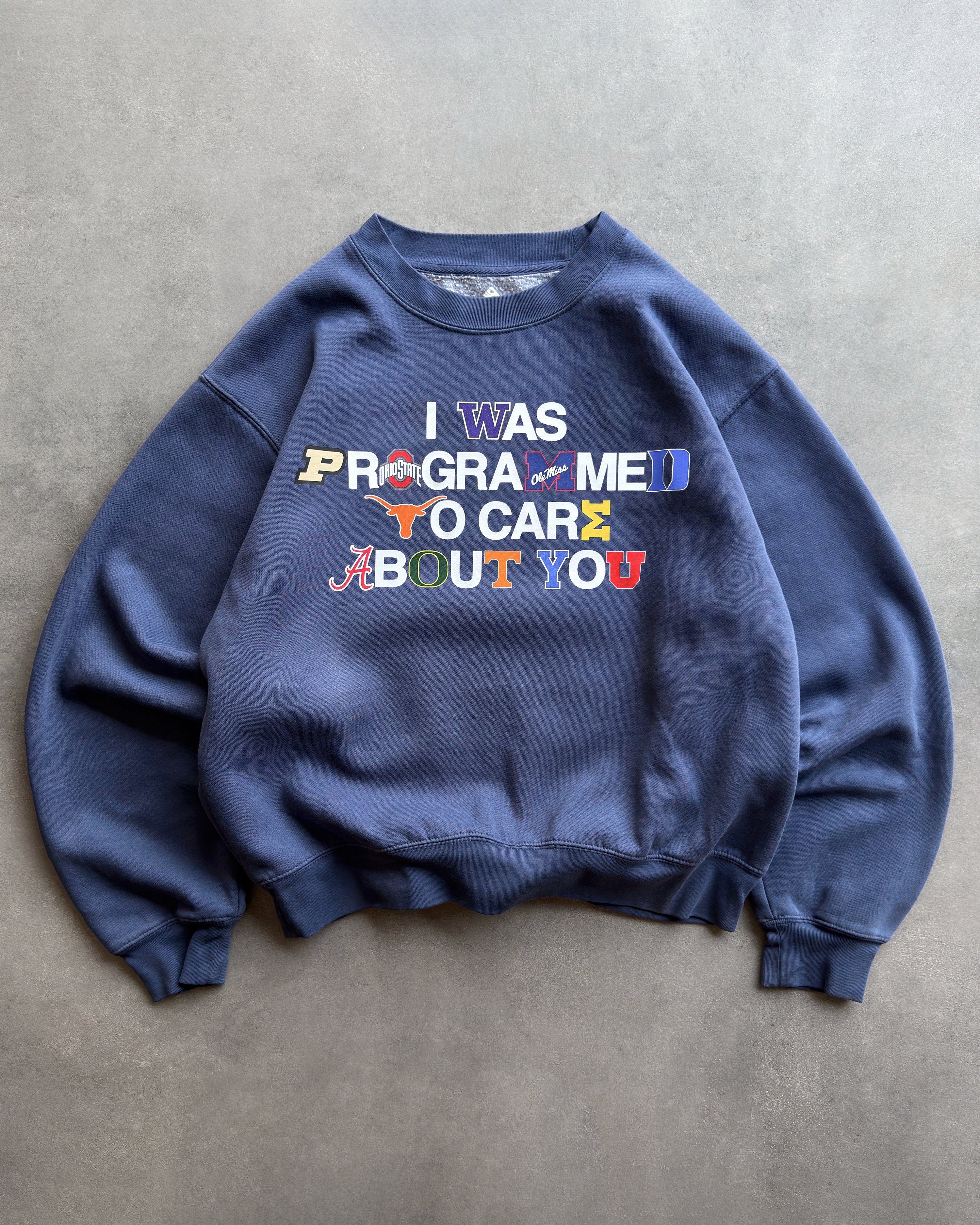 "PROGRAMMED TO CARE" COLLEGE CREWNECK SWEATSHIRT
