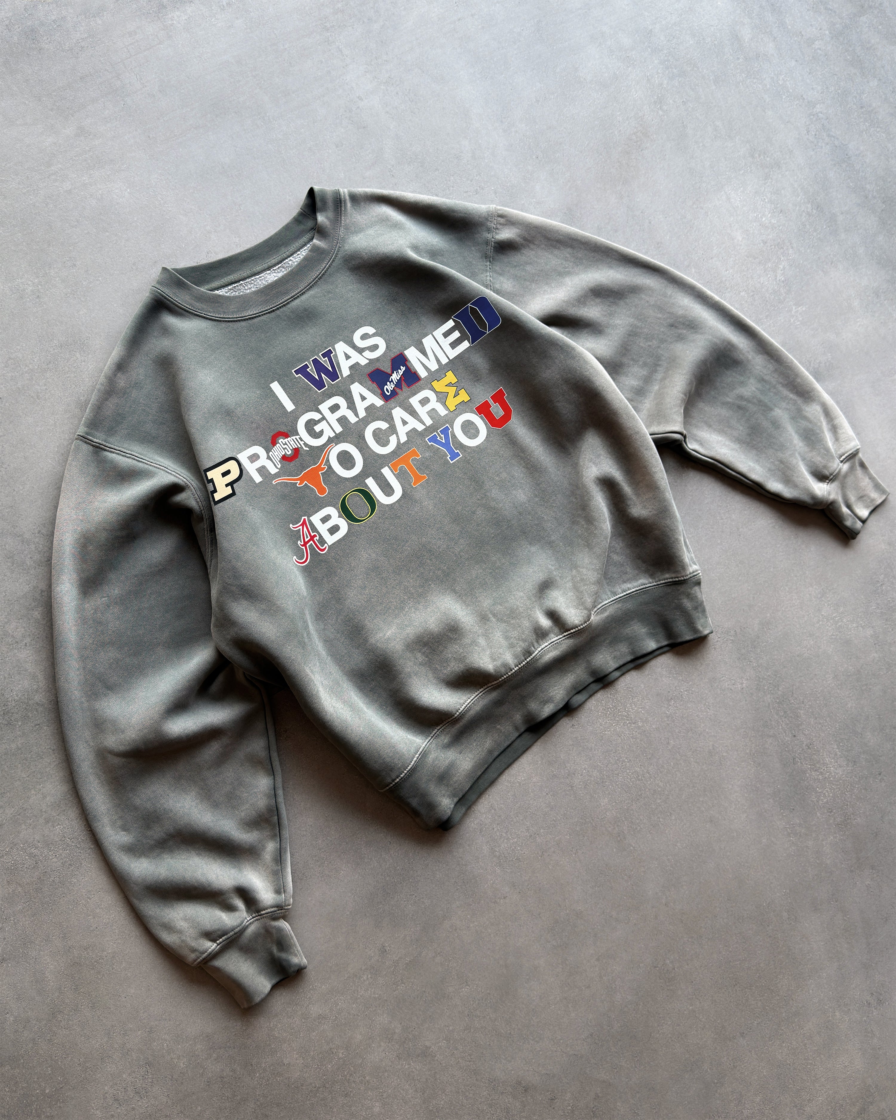"PROGRAMMED TO CARE" COLLEGE CREWNECK SWEATSHIRT
